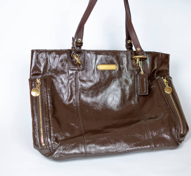 istock Leather bag with gold-plated hardware and high handles 1464726089