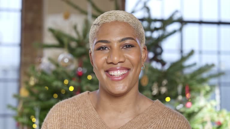 Portrait of cheerful mid adult Black woman at Christmas