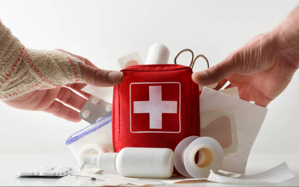 istock First aid kit concept with hands picking up bag full 1464726632