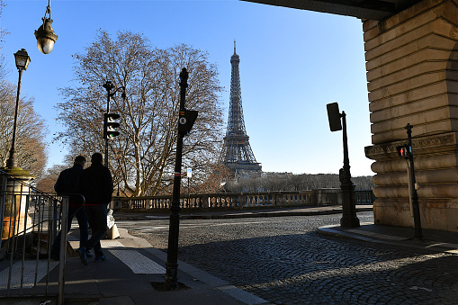 Paris, France-02 07 2023: Silhouettes of two people on the Bir-Hakeim bridge facing the Eiffel tower, Paris, France.