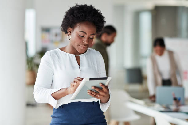 istock Creative black woman, tablet and design in focus for planning, strategy or schedule for startup. African American female employee designer working on touchscreen for web or online research at office 1464735672