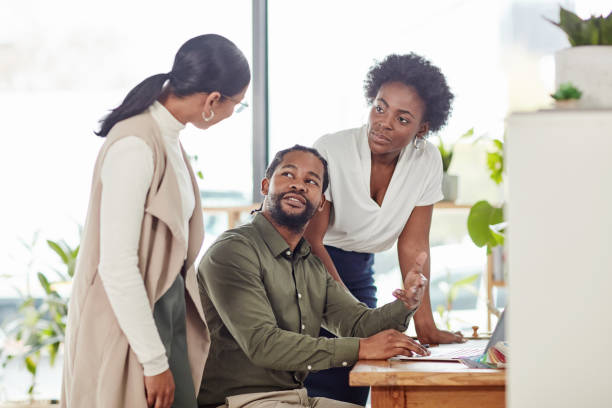 istock Office communication, collaboration and people consulting on social media feedback, customer experience or ecommerce. Laptop brand monitoring, teamwork talk or media team review of online survey data 1464735907