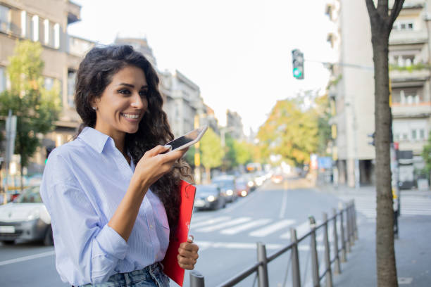 istock Happy young woman using phone 1464740057
