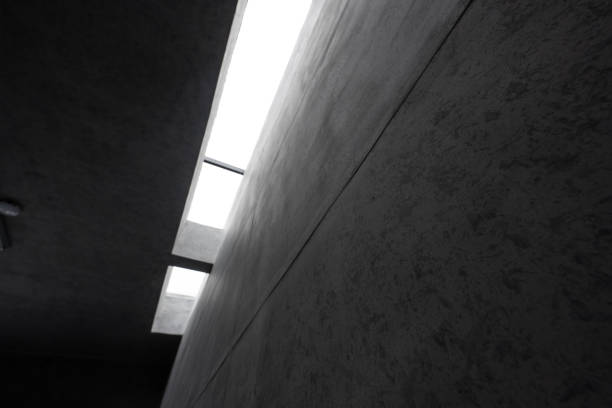 istock A corner of ceiling wall of gray concrete building 1464740059