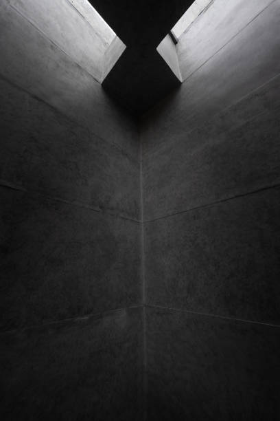 istock A corner of ceiling wall of gray concrete building 1464740084