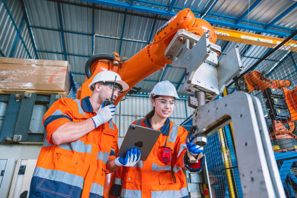 istock engineer team worker working with robot arm assembly machine in modern metal heavy industry factory 1464741798
