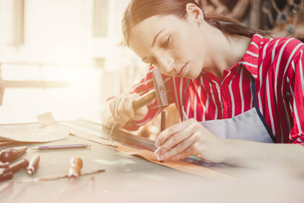 istock woman leather tailor artist handcraft working at own workshop small studio made by order masterwork piece 1464742478