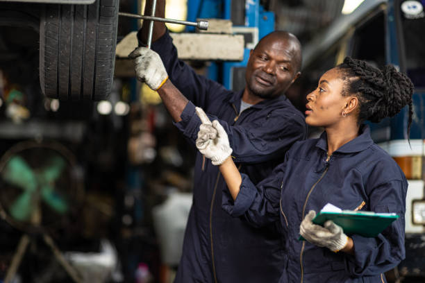 istock garage mechanic team working car auto service black african people professional worker together 1464742711