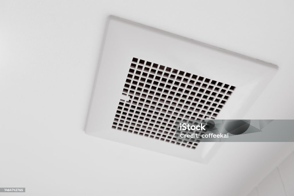 Toilet air ventilator.Bathroom fan air flow grill for room deodorizing and dehumidifying. Air Duct Stock Photo