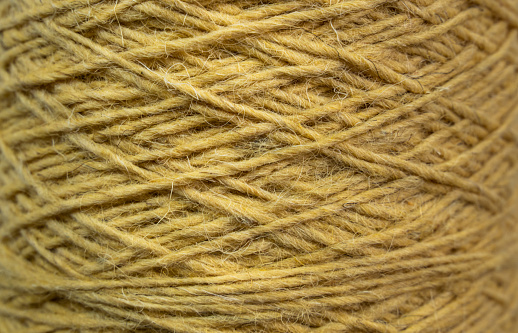 Close-up shot of natural yellow silk wool yarn