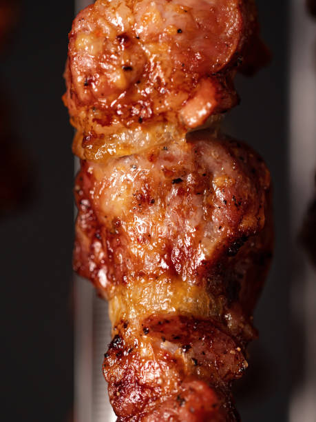 istock Cooking pork kebab in electrical barbecue on skewers 1464747493