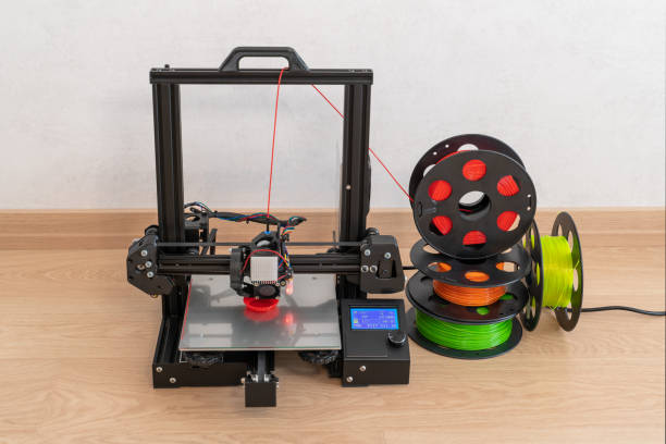 modern 3d printer and multi-colored filament spools - printout industry printer workshop imagens e fotografias de stock