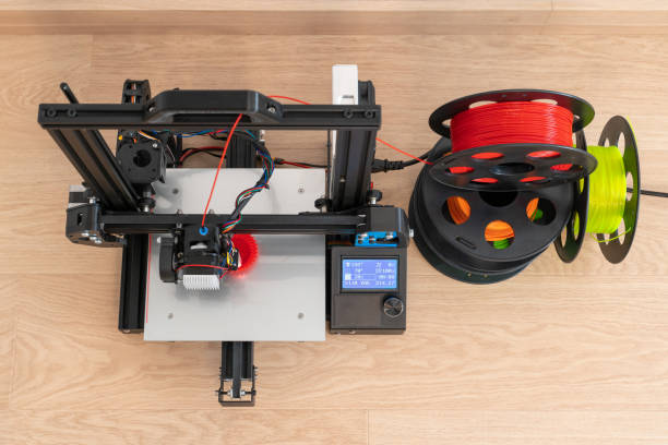 modern 3d printer and multi-colored filament spools - printout industry printer workshop imagens e fotografias de stock