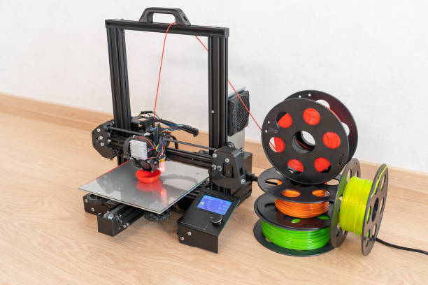 modern 3d printer and multi-colored filament spools - printout industry printer workshop imagens e fotografias de stock