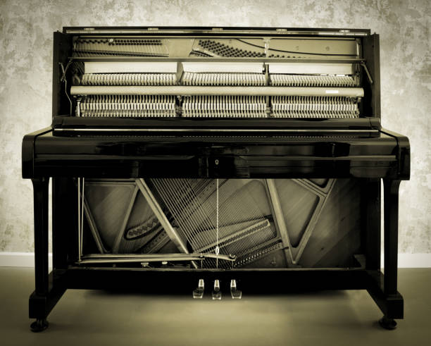 istock Details of piano mechanism gavel - string, pins and hammers 1464753225