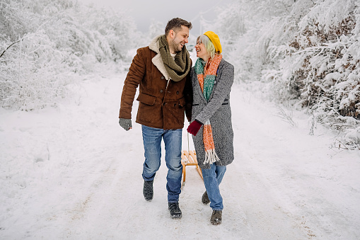 Loving couple is having fun in the snow