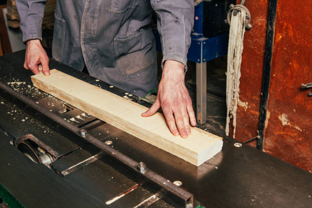 istock Work on woodworking machines and saws in a furniture workshop 1464758094