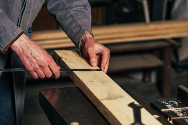 istock Work on woodworking machines and saws in a furniture workshop 1464758215