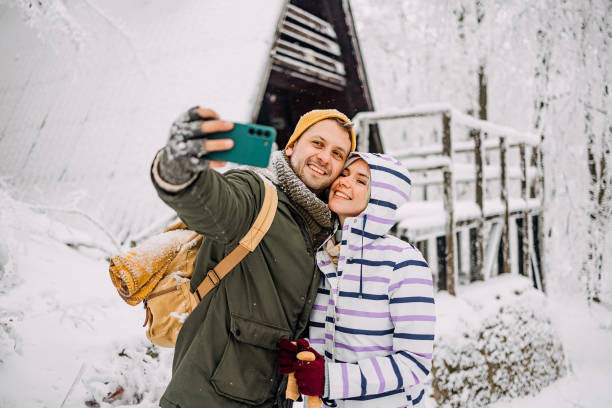 istock Young couple in love take a selfie 1464758629