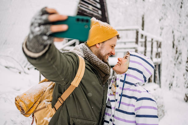 istock Young couple in love take a selfie 1464758642