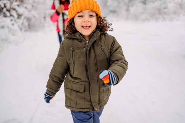 Mother and son playing in snow