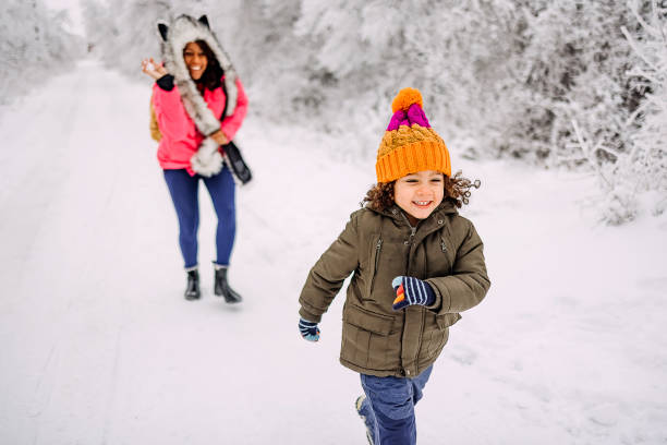 istock Mother and son playing in snow 1464759022