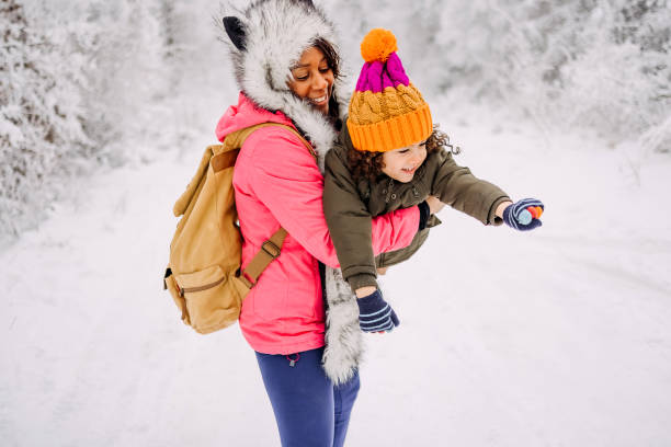 istock Mother and son playing in snow 1464759045