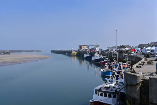 istock Fishing harbour with a clear blue sky 1464759746