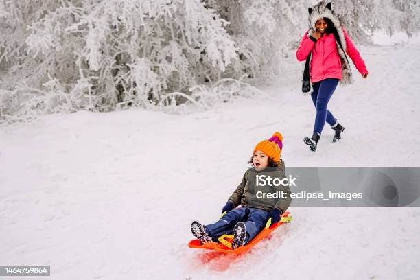Mother and son playing in snow