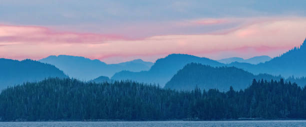 Hazy mountains along the coast of Alaska's Inside Passage. Hazy mountains along the coast of Alaska's Inside Passage. southeastern alaska stock pictures, royalty-free photos & images