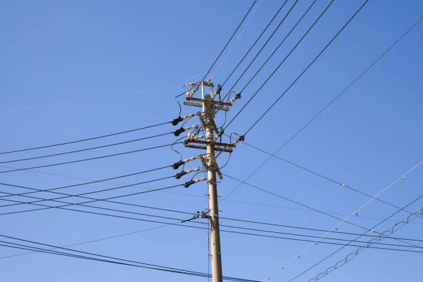 istock Beautiful sky with floating clouds, utility poles and wires 1464760851