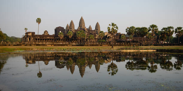 istock Panoramic scenery of angkor wat complex reflected on lake in the morning. Siem reap Campodia Asia 1464762165