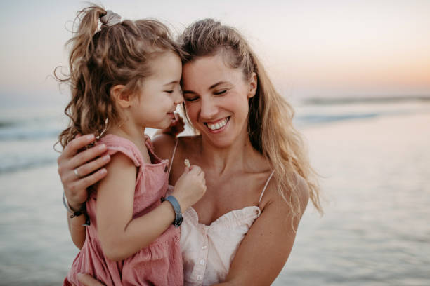 istock Mother enjoying together time with her daughter at sea. 1464763528