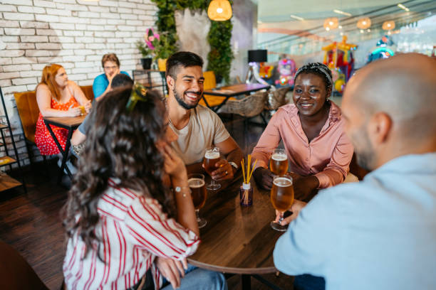 istock Group Of Friends Drinking Beer In A Bar 1464763760