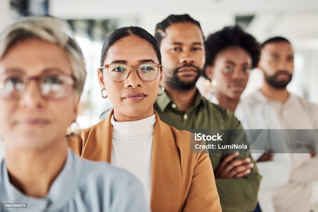 Business people, portrait and leadership in office for vision, mission and partnership, proud and support. Leader, collaboration and teamwork by empowered team with idea, mindset and company goal Toughness Stock Photo