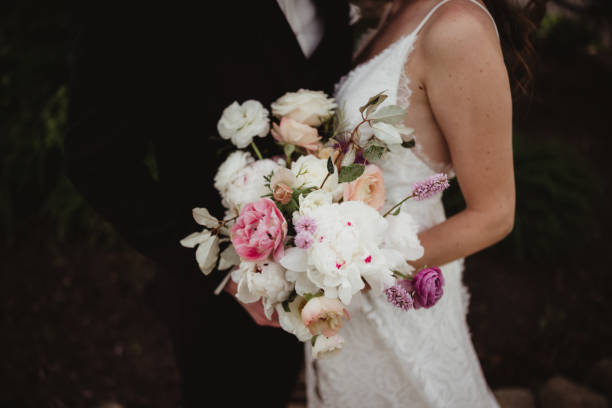 istock Bride and groom with flowers 1464765491
