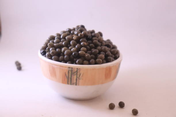 istock Studio shot of papaya seed in bowl 1464768350