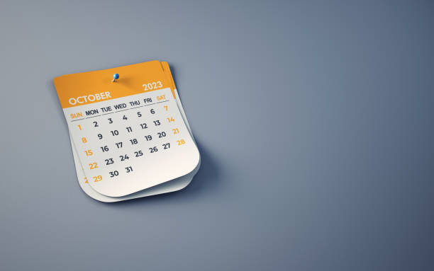 istock Yellow October 2023 Calendar On Smoked Background, Blue Pushpin Pinned, Clipping Path 1464768968