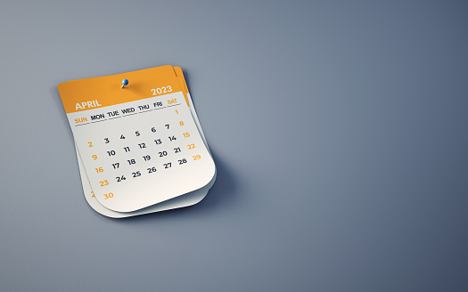 3d render Yellow April 2023 Calendar On Smoked Background, Blue Pushpin Pinned, Clipping Path, Can be used for reminder day, special day concept (Close-Up)