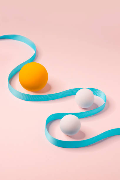 istock Abstract still life coloured spheres and curved line on pink background. 1464769814