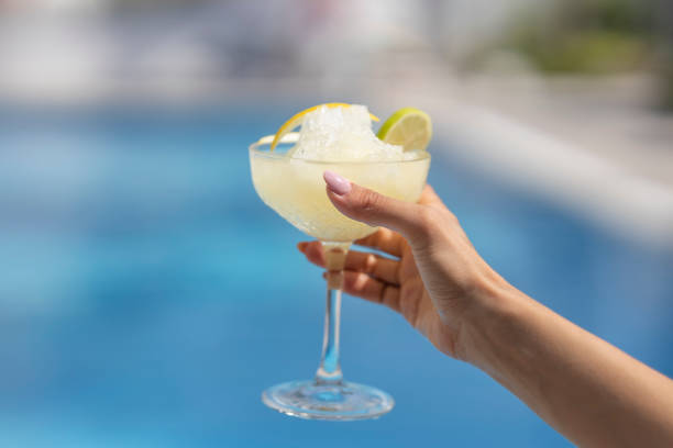 istock a woman drinking a delicious cocktail 1464769971