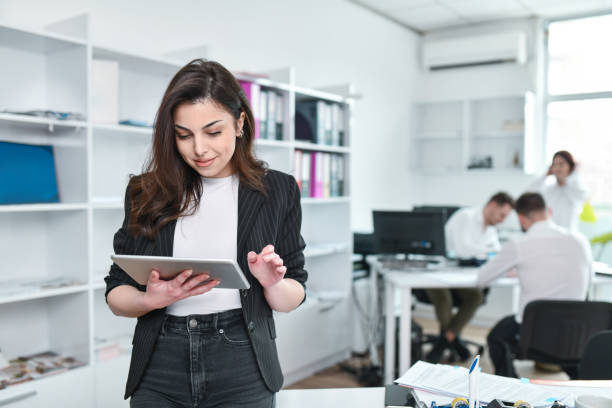 istock Female Accountant Using New Financial Benefits From Digital Tablet App 1464770881