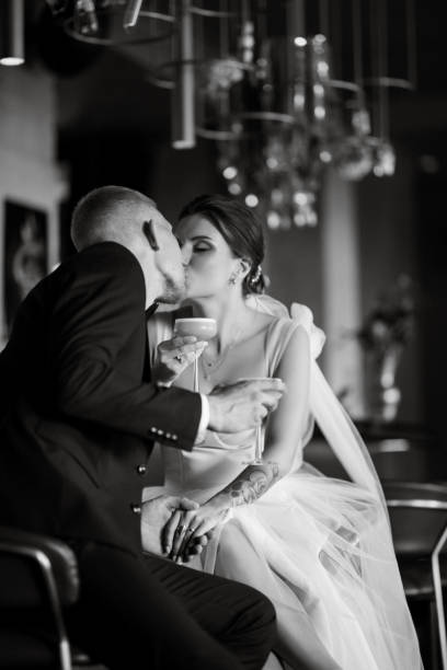 istock bride and groom inside a cocktail bar 1464770941
