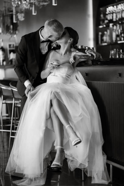 istock bride and groom inside a cocktail bar 1464770962