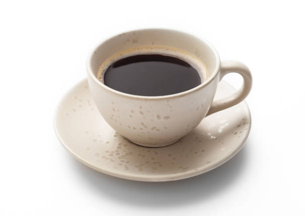 istock Fresh hot black creamy coffee in light porcelain cup on white background. 1464771379