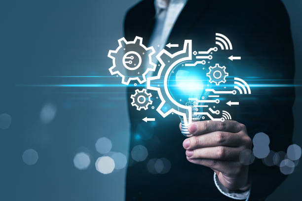 istock AI (Artificial intelligence) concept, ai machine learning, person hold light bulb with ai and gears cogs icons, deep learning, automation, problem solving, cloud computing, quantum computing, IOT. 1464772367