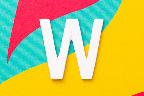 istock Letter W of the alphabet on colored background, top view 1464772515