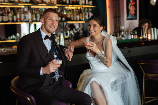 istock bride and groom inside a cocktail bar 1464772518