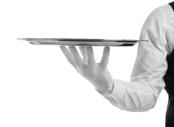 istock Elegant butler holding silver tray isolated on white, closeup 1464772787