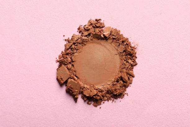 istock Crushed eye shadow on pink background, top view 1464773089
